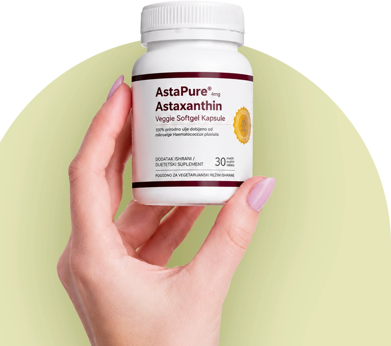female hand holding astapure astaxanthin bottle
